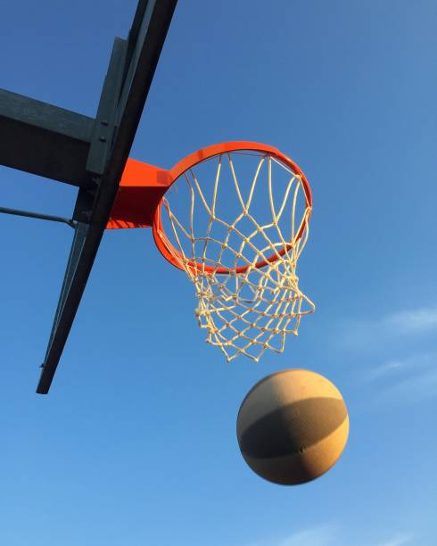 istock Playing basketball outdoors 1186282849