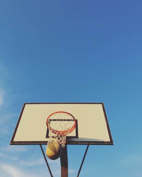 istock Playing basketball outdoors 1186282869
