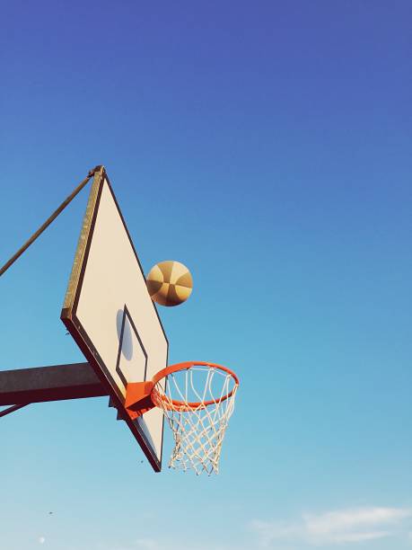 istock Playing basketball outdoors 1186282879