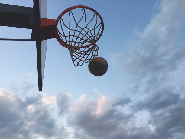istock Playing basketball outdoors 1186282886