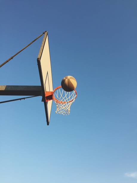istock Playing basketball outdoors 1186282894