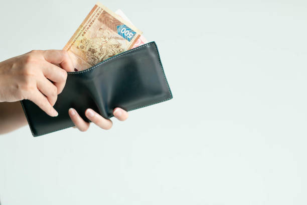 istock Hands picking Hong Kong money (Dollar Hong Kong or HKD) from short wallet for payment. 1186283933