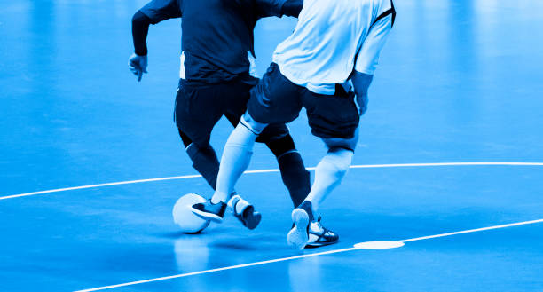 istock Low Section Of People Playing Soccer 1186286545