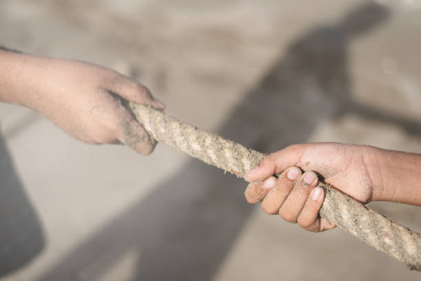 istock Close-Up Of Hands Holding Rope 1186287118