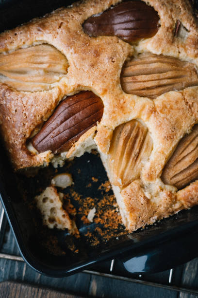 Fall french pear cake in a black ceramic bakeware