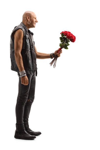 istock Bald punk giving a bunch of red roses 1186289465