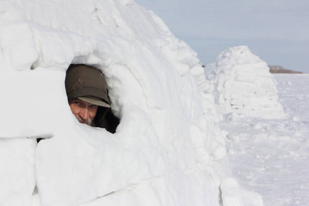 istock Head of a man sitting in an igloo in winter 1186292465