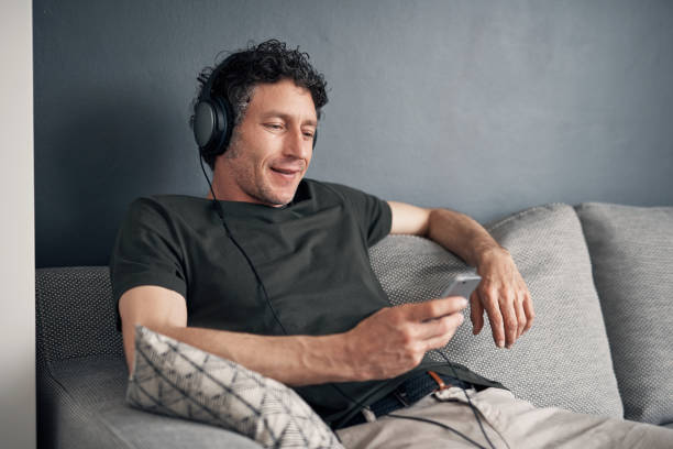 istock Selecting a few chilled tracks to ease him into the day 1186298876