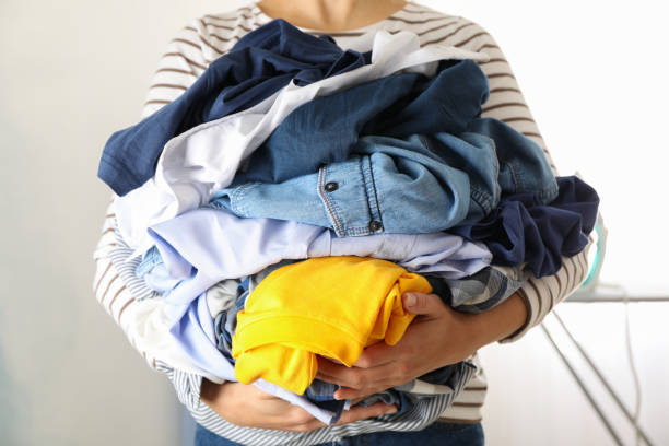 istock Young woman hold crumpled clothes, space for text 1186300441