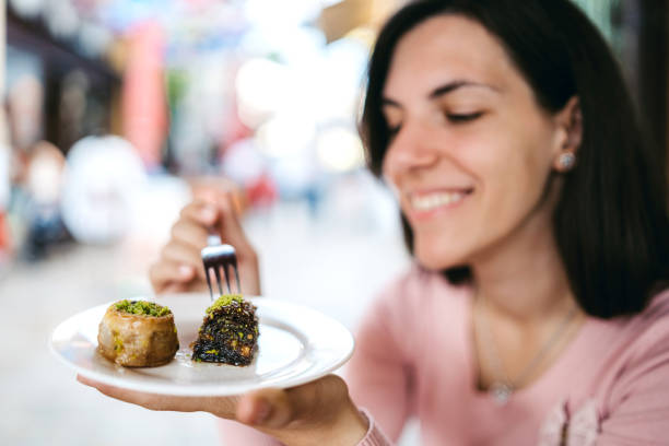 istock Eating baklava in old Bazaar street 1186301814