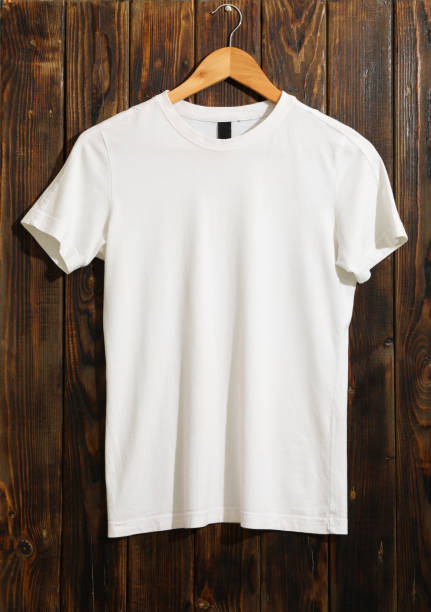 istock Hanger with blank white t-shirt on wooden background, space for text 1186301997