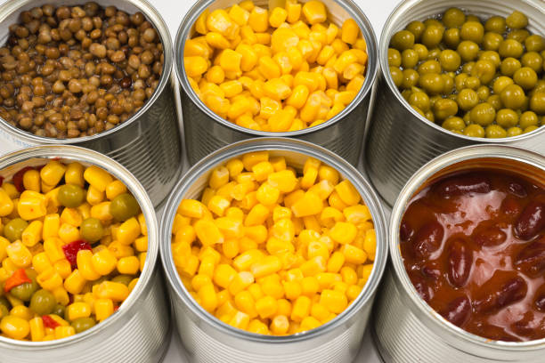 istock Canned food on white background. Green pea, beans, corn, lentils. 1186302652