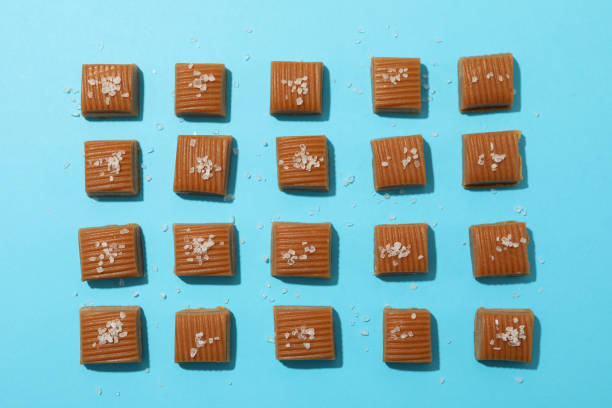 istock Flat lay with salted candies on blue background, close up 1186302926