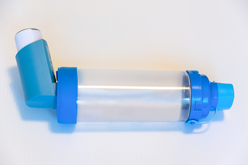 An Asthma reliever inhaler ready for use during an attack with a spacer