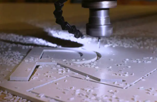 Photo of Cutting the letters of the alphabet from plastic on a milling machine