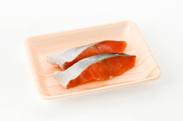 istock Coho Salmon fillet in foam tray on white background 1186317434