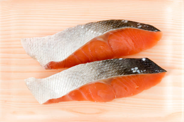 istock Coho Salmon fillet in foam tray on white background 1186317491