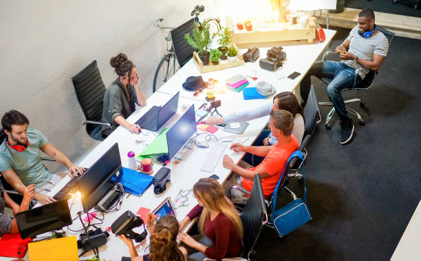istock Young co-workers team talking during startup - Happy people planning a new project in creative workplace office - Technology, entrepreneur, marketing and concept - Focus on top right guys 1186317768