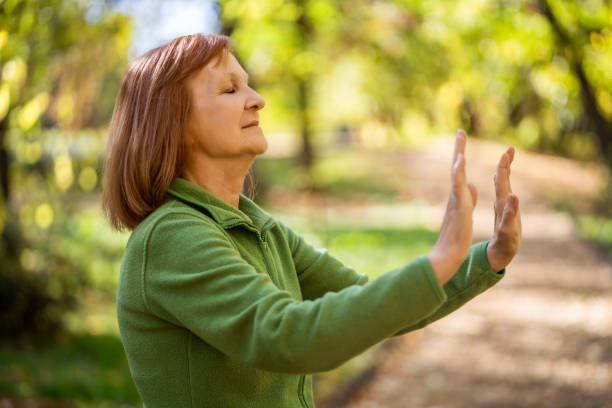 istock Senior woman is practicing Tai Chi 1186322043