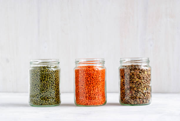 istock Dried Mung beans, and lentils in glass jars 1186322438