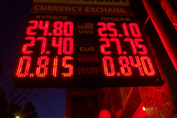 istock Currency exchange rates sign glowing in red 1186323310
