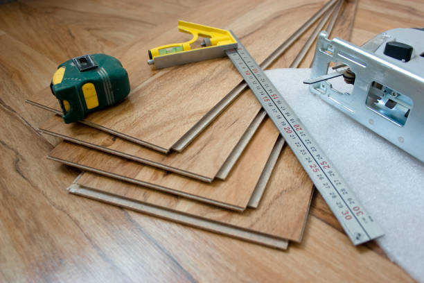 Tool for laying laminate flooring stock photo