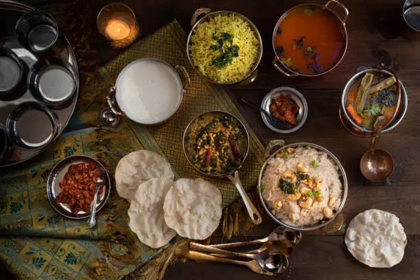 South Indian vegetarian food served in  traditional copper servingware