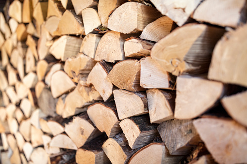 Firewood stack of chopped wood background