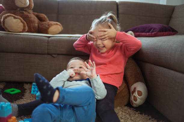 istock Babies playing with toys at home 1186332590