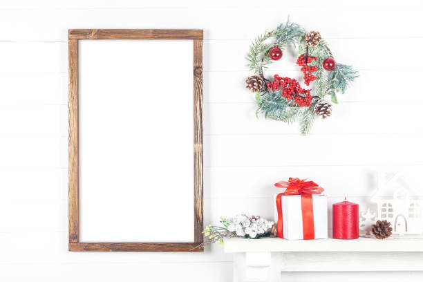 istock Christmas Wooden Frame Mockup, Vertical Empty Frame on a Light Background 1186333129