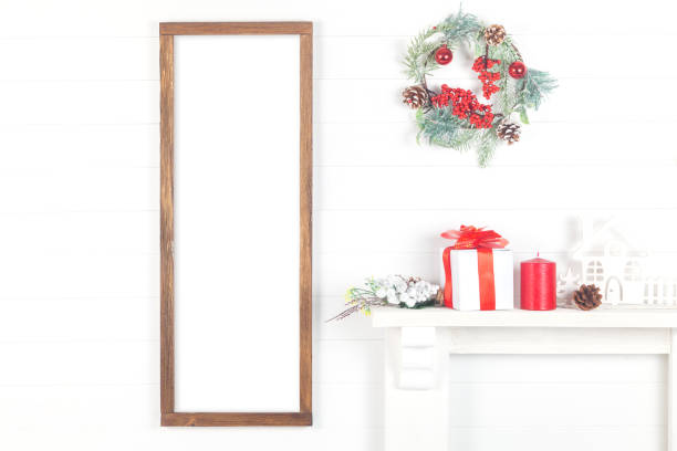 istock Christmas Wooden Frame Mockup, Vertical Empty Frame on a Light Background 1186333142