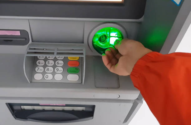 ATM for receiving funds. Hands of a man at an ATM. stock photo