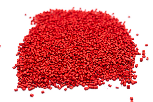 Red color Plastic beads on white background, Resin plastics for industrial