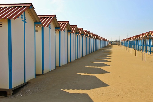 Closed beach huts on the famous Lido beach in Venice, in the low season in October. Lido di Venezia, Italy, South Europe.