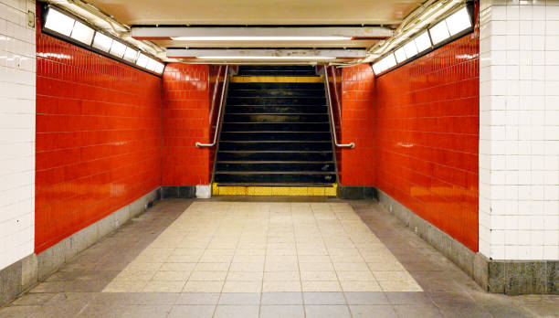 istock Stairs Descending into Red NYC Subway Station Interior 1186337530