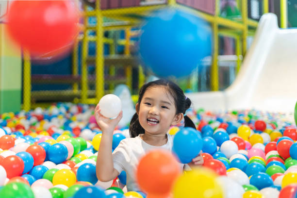 istock Cute girl at the Ball Pool 1186338498