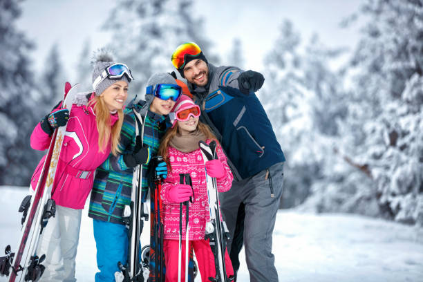 istock family smiling and making selfie on winter ski vacation 1186344652