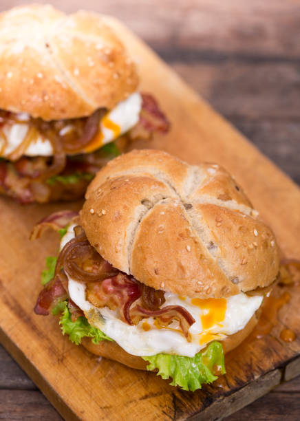istock Bacon and egg sandwiches with onions and lettuce 1186345095