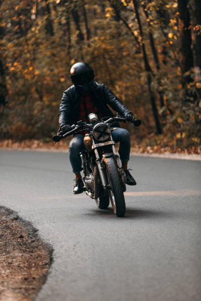 istock Vintage motorcycle ride in the woods 1186347562