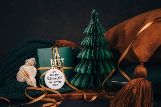 Christmas still with christmas gift and tree with home textiles Soft home interior gifts arrangement