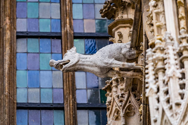 Grotesque gargoyle water spout sculpture on facade of gothic medieval St. Stephen's Cathedral or Stephansdom in Vienna, Austria