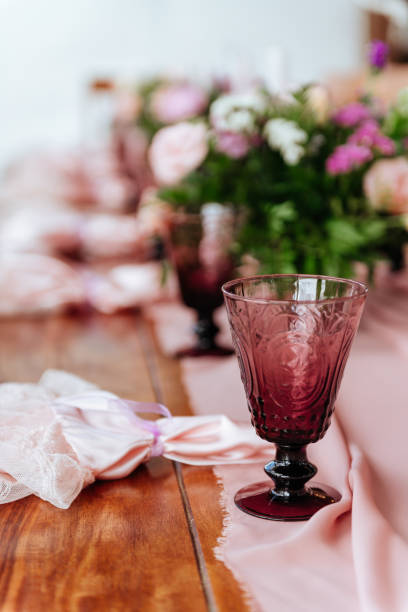 istock Vintage festive table setting with pink roses, candles and cutlery 1186352794