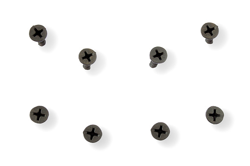 Drywall and black screws from different angles on a white background.