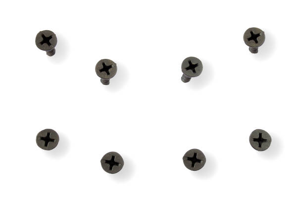 drywall and black screws from different angles on a white background. the screw is screwed into the drywall. black screws isolated on white. fixing screws for construction on a white background. - screw human head bolt isolated imagens e fotografias de stock