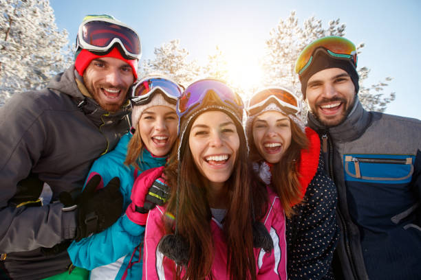 istock Happy couple having fun in snowy nature 1186353098