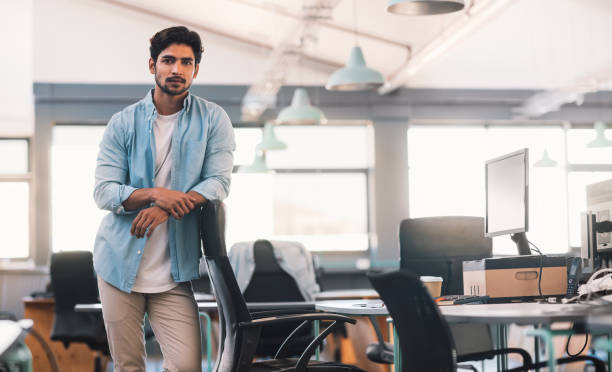 istock Confident young businessman leaning on his office chair 1186355444