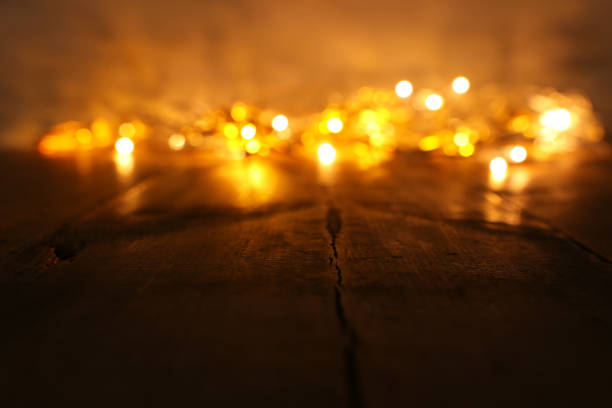 istock background image of abstract blurred gold garland lights. defocused 1186355608