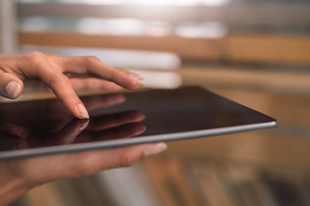 istock Businesswoman working on a digital tablet in an office 1186355736
