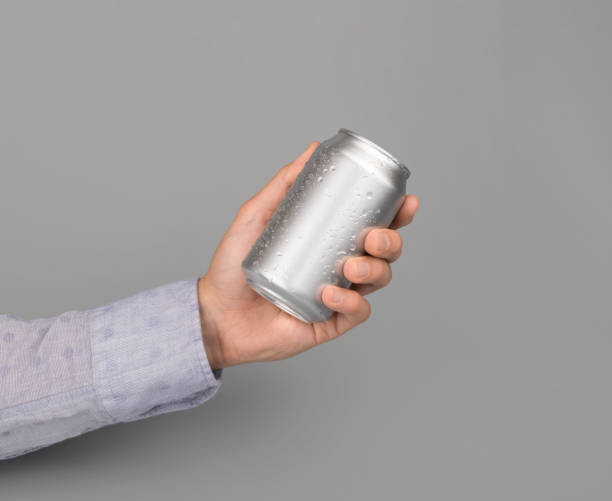 istock Hand holds metal beverage drink can 1186361316