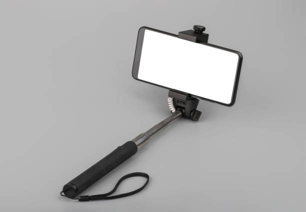 istock selfie stick with phone on grey background 1186361366